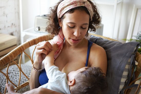 Baby pinching while sales nursing